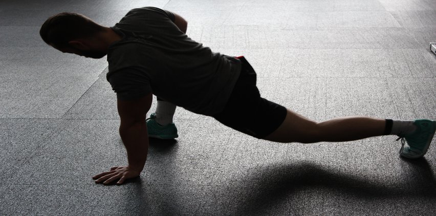 man stretching motivated to work out