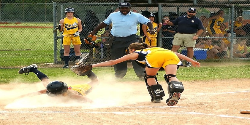 female athletes playing softbal