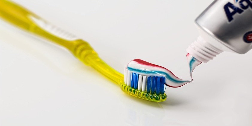 Pixabay. Red, white and blue toothpaste on a yellow toothbrush