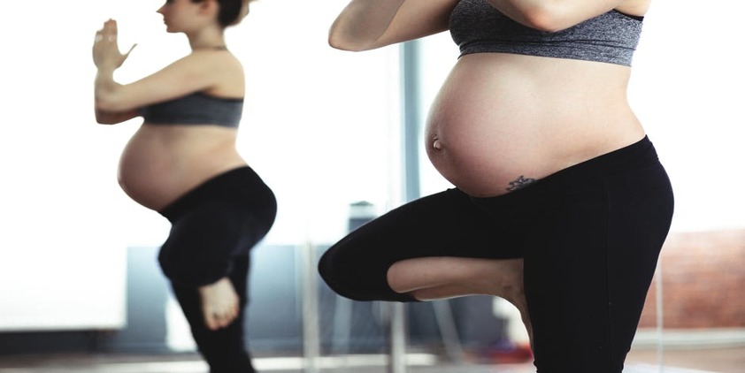 Pexels. Pregnany women doing yoga