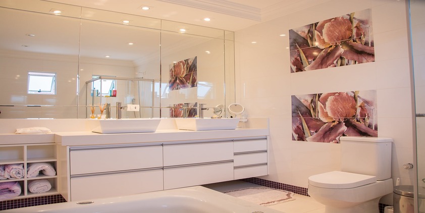pexels. clean bathroom with pink and purple paintings