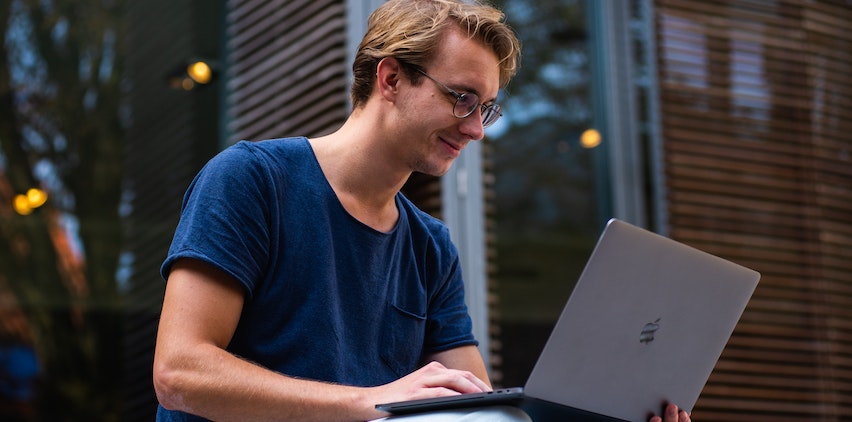 Man working on his laptop computer.