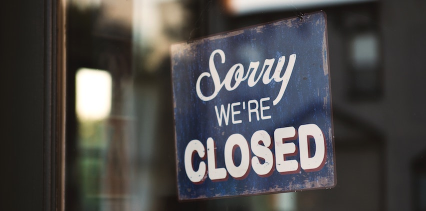 "Sorry we're closed" sign to represent freelance business slowdowns in summer