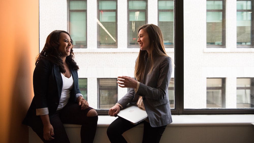 Two businesswomen chatting