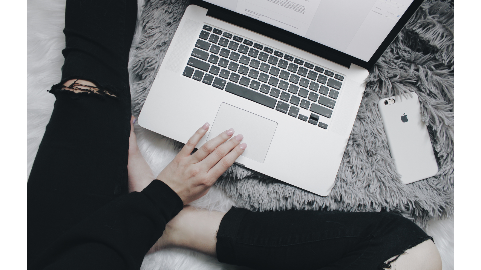 woman typing on laptop learning how to make money on fiverr